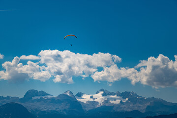 Fototapeta na wymiar Paraglider over Altaussee with Dachstein in Background, Salzkammergut, Austria