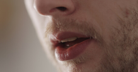 Closeup mans mouth with bristles on a face