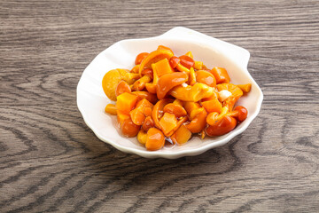 Marinated pickled honey mushrooms in the bowl