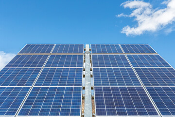 Obraz premium solar panels against a blue sky