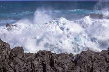 waves crashing on rocks