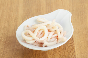Marinated squid strips in the bowl