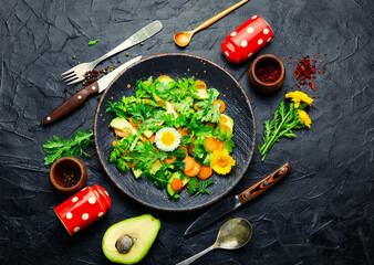 Spring salad with chrysanthemum leaves and avocado