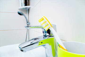 Toothbrush on the sink in the bathroom
