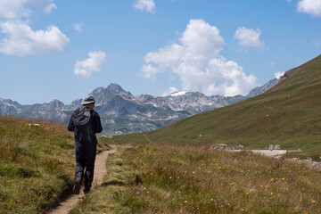 Fototapeta na wymiar Mountain landscape in summer with a hiker