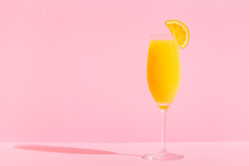 Refreshing orange Mimosa cocktails with champagne.