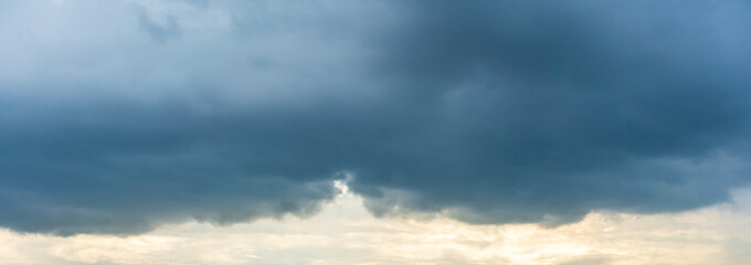 Naklejka na ściany i meble Dramatic sky of dark clouds on a stormy day