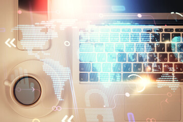 Double exposure of map hologram drawing over study table background with computer. Concept of international network. Top view.