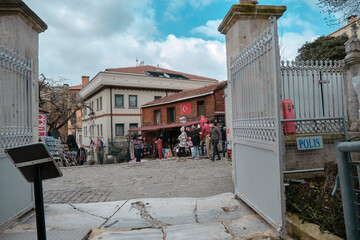 istanbul Turkey Exit gate of Hagia sophia mosque and local traditional souvenirs sellers and turkish flag.