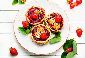 Summer biscuit with strawberries on white table