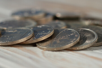 Soviet jubilee rubles on wooden background closeup. Shallow depth of field