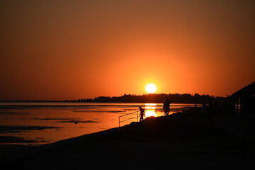 Silhouettes of seashore in the deep evening,picturesque photo