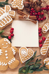 Christmas decoration with cookies and spices around note paper