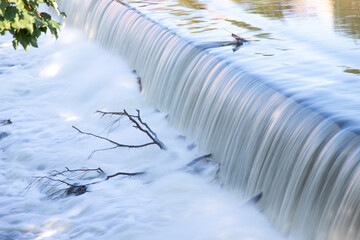 man-made waterfall on a river