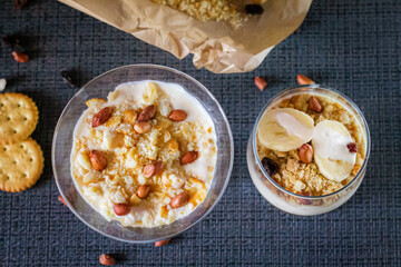 Delicious and healthy yogurt dessert with banana, biscuits and nuts.