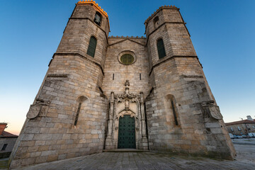Fototapeta na wymiar View of the Manueline Style main entrance of the Guarda Cathedral (Se da Guarda) in the city of Guarda, Portugal.