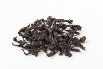 dry black tea leaf isolated on white background