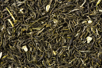 dried jasmine scented tea leaf texture background