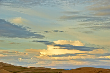 Evening cloudy sky over the sand dunes.