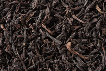 dried black tea leaf texture background