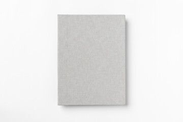 Grey hardcover book, isolated on white background. Top view