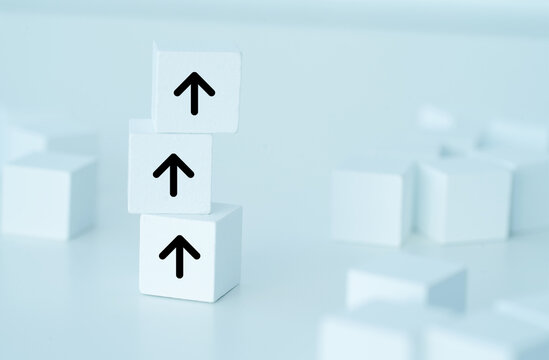 Arrow pointing up on white cube
