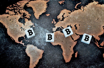Cryptocurrency Investment Image.  Bitcoin symbol on white cube on world map