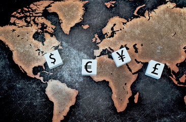 Currency Investment Image.  Major international currency symbol on white cube on world map