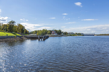 Fototapeta premium Hydroelectric power station on the Volga river in Yaroslavl region on a sunny day. Launched in 1940. Cultural heritage site. Uglich, Russia