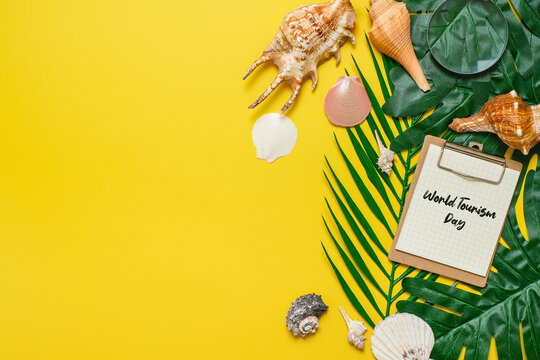 World Tourism Day incription over yellow background