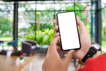 Man holding smart phone with blurred background. For Graphic display montage