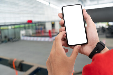 Man holding smart phone with blurred background. For Graphic display montage