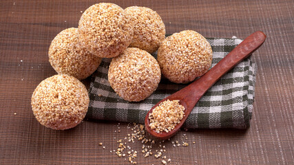 Amarnath seed, Cholai or Rajgira laddo, Also in cube shape called chikki or cake form, Indian sweet and healthy food served in a plate and bowl. Selective focus.