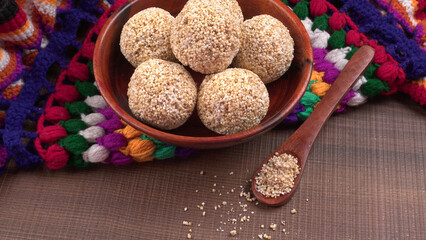 Amarnath seed, Cholai or Rajgira laddo, Also in cube shape called chikki or cake form, Indian sweet and healthy food served in a plate and bowl. Selective focus.
