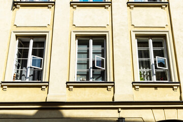 Three windows of an old classic building