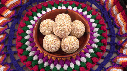 Amarnath seed, Cholai or Rajgira laddo, Also in cube shape called chikki or cake form, Indian sweet and healthy food served in a plate and bowl. Selective focus.