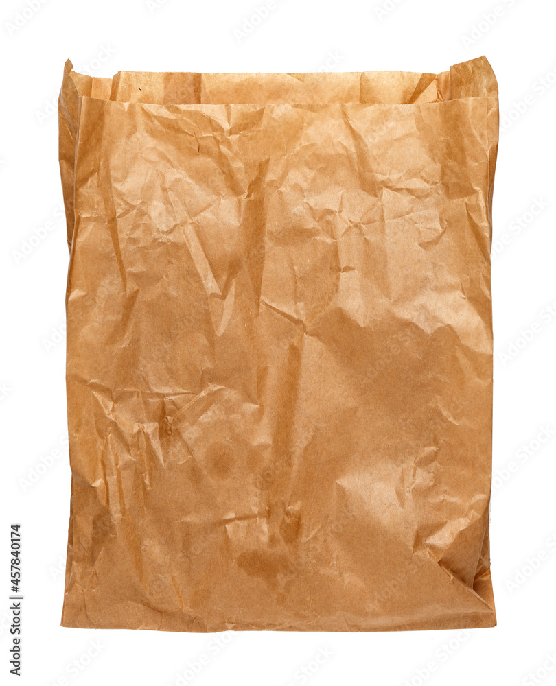 Wall mural Crumpled, used brown paper bag isolated on white background