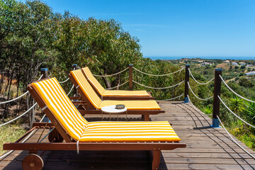 Luxury loungers for relaxation and sunbathing in the forest countryside, for tourists.