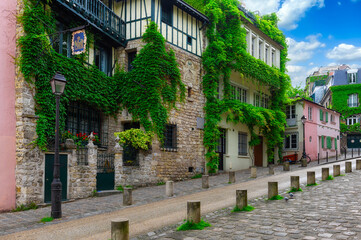 Cozy street in quarter Montmartre in Paris, France. Architecture and landmarks of Paris. Postcard...