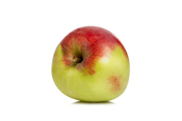 Ripe red-green apple. Harvest season. Vitamins and health from nature. Isolated on white background. Close-up.