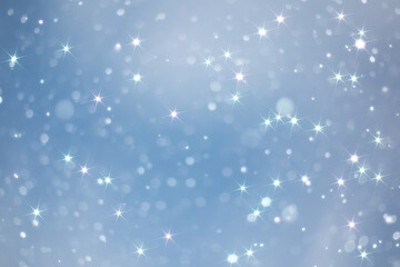 Obraz na płótnie Canvas blue snowfall bokeh background, abstract snowflake background on blurred abstract blue