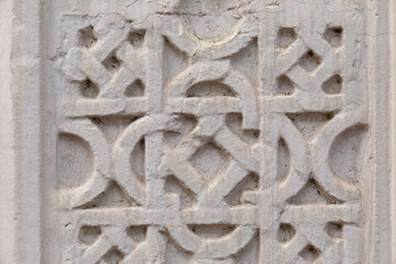 Antique plaster molding. Old wall background. Carved old patterns.