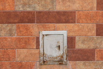 Brick texture. Brickwork wall background with access hatch. rustic texture.