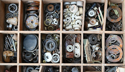 Different old washers in a wooden tool box on a flea market in Berlin-Germany.