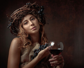 Attractive woman with red wine and blue grapes.