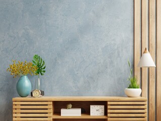Blue wall mockup in modern empty room on wooden cabinet.