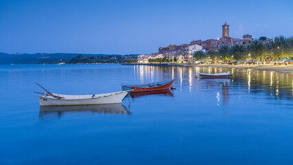 Fototapeta na wymiar panoramic view to boats on lake Bolsena in city Marta in Italy