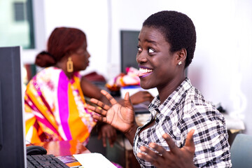 beautiful young happy businesswoman looking at laptop screen.