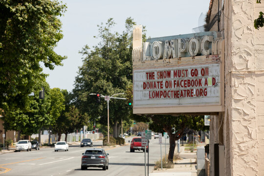 Lompoc, California, USA - July 25, 2021: Midday sun shines on the historic downtown Lompoc Theatre.