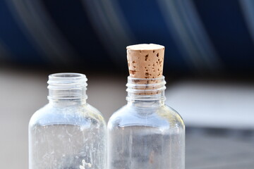 Bottles with a Cork on One of the Bottles